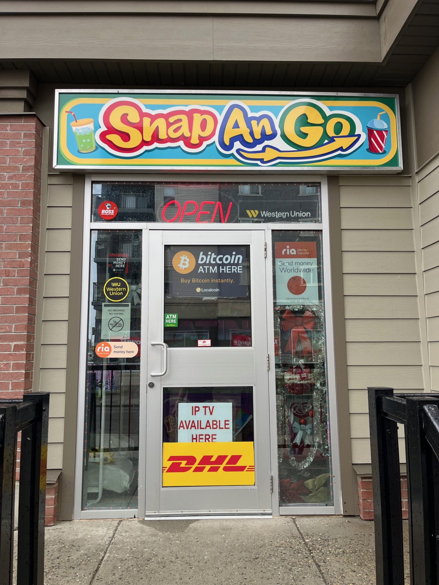 The colourful Snap An Go sign above the store entrance